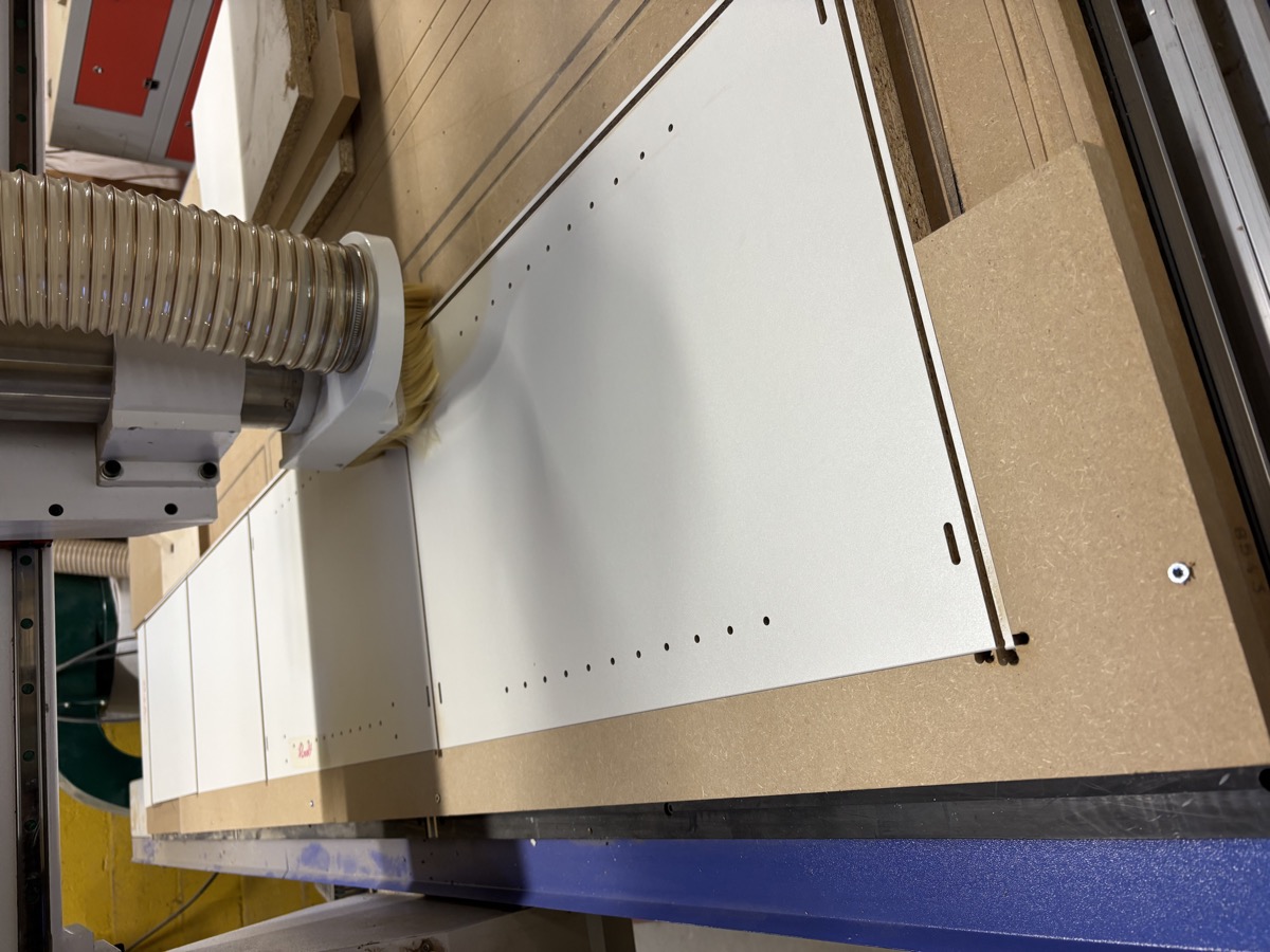 CNC machine cutting cabinet panels